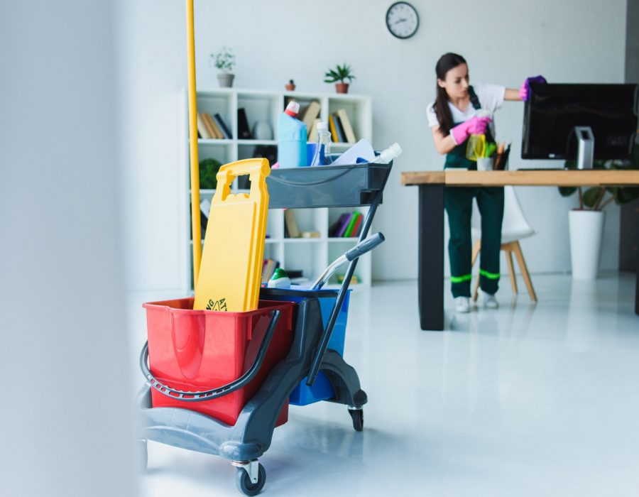 young-female-janitor-cleaning-office-with-various-2022-12-16-18-52-29-utc-min young-female-janitor-cleaning-office-with-various-2022-12-16-18-52-29-utc-min